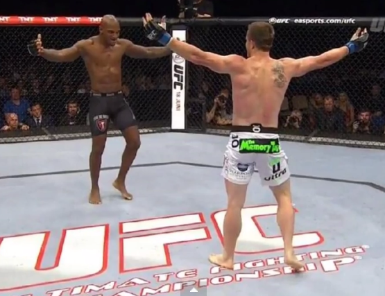 Co-Headliners Francis Carmont and CB Dollaway posturing on a bare UFC Berlin Octagon canvas.
